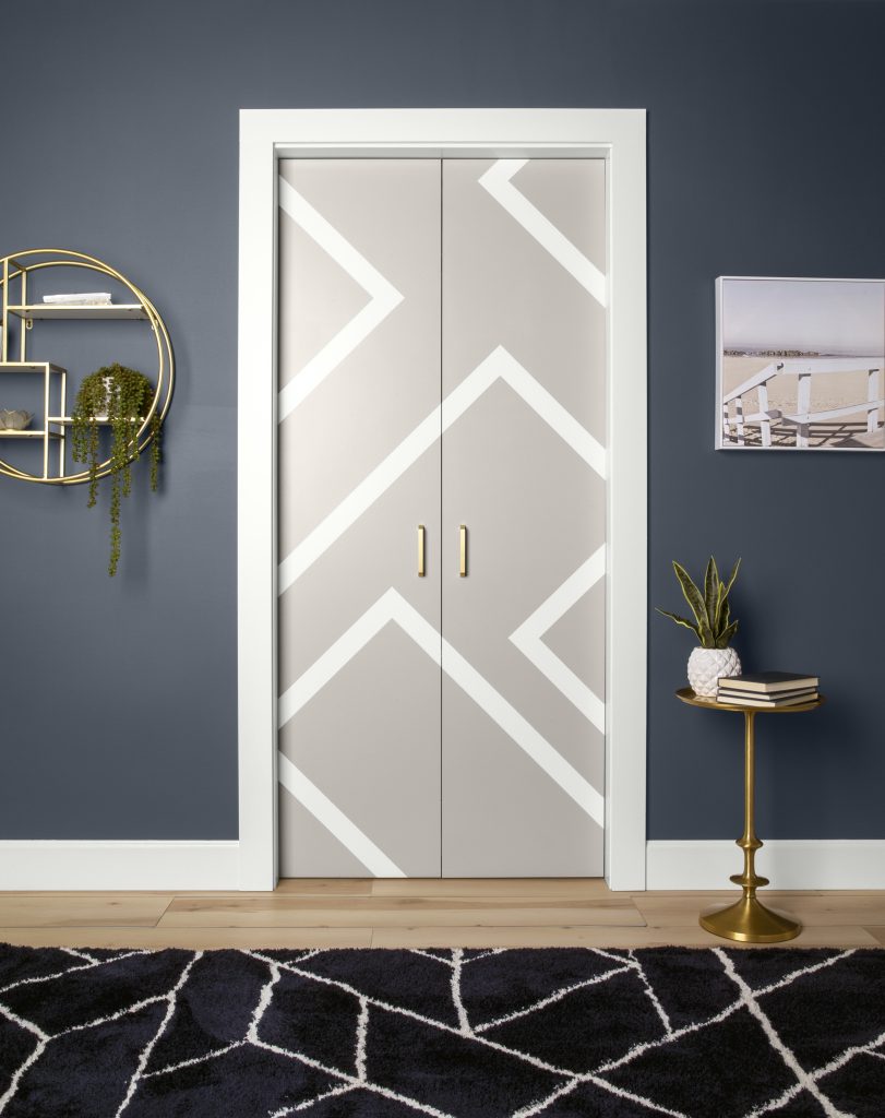 Calligraphy wall with Polar Bear trim and Cotton Grey closet doors with white geometric accents