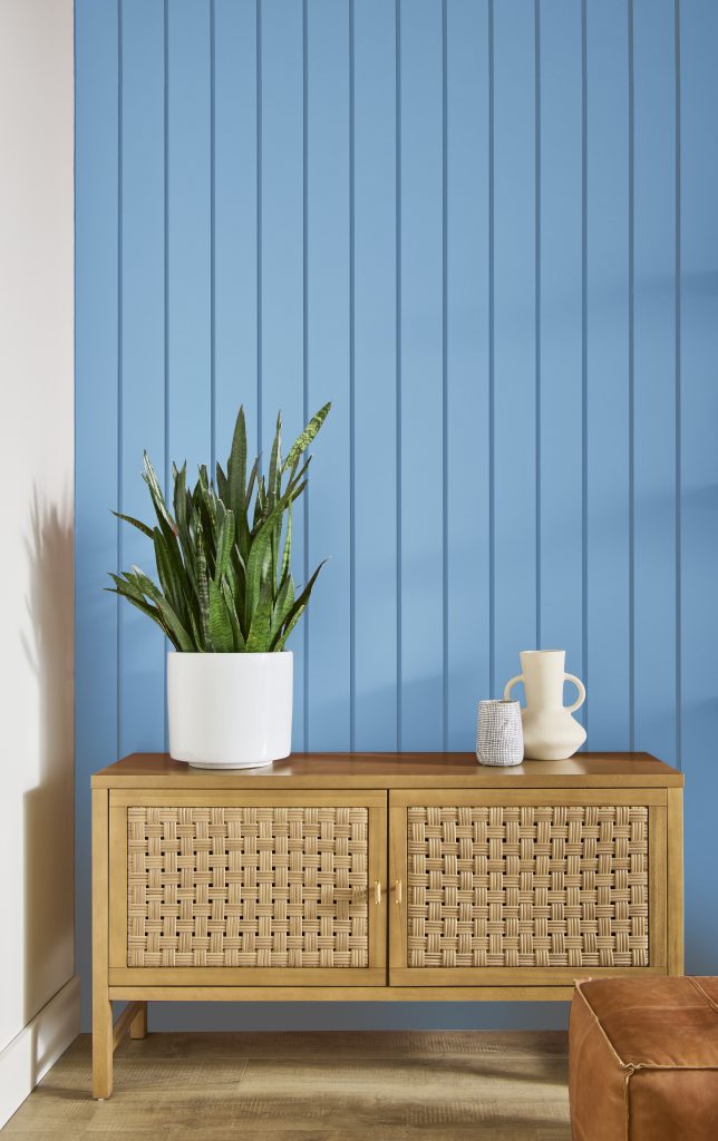 Room featuring a bright cheerful blue accent wall.