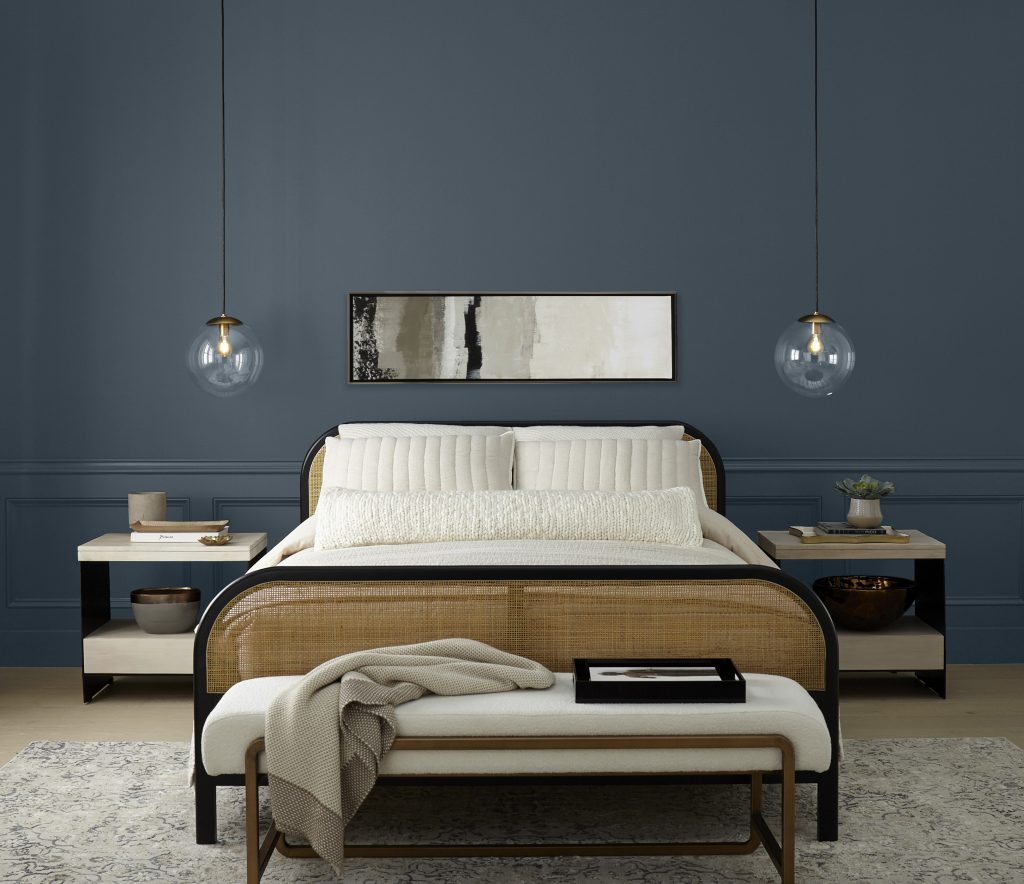 A bedroom with deep navy blue walls in Midnight Blue.
