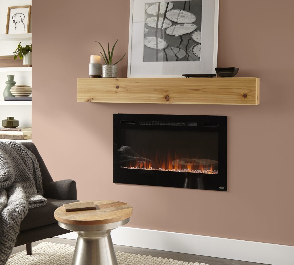 Living room with fireplace wall painted Sedona Pink S190-3, a warm peach-brown hue paired with natural wood, creamy textiles, and soft neutral accents.