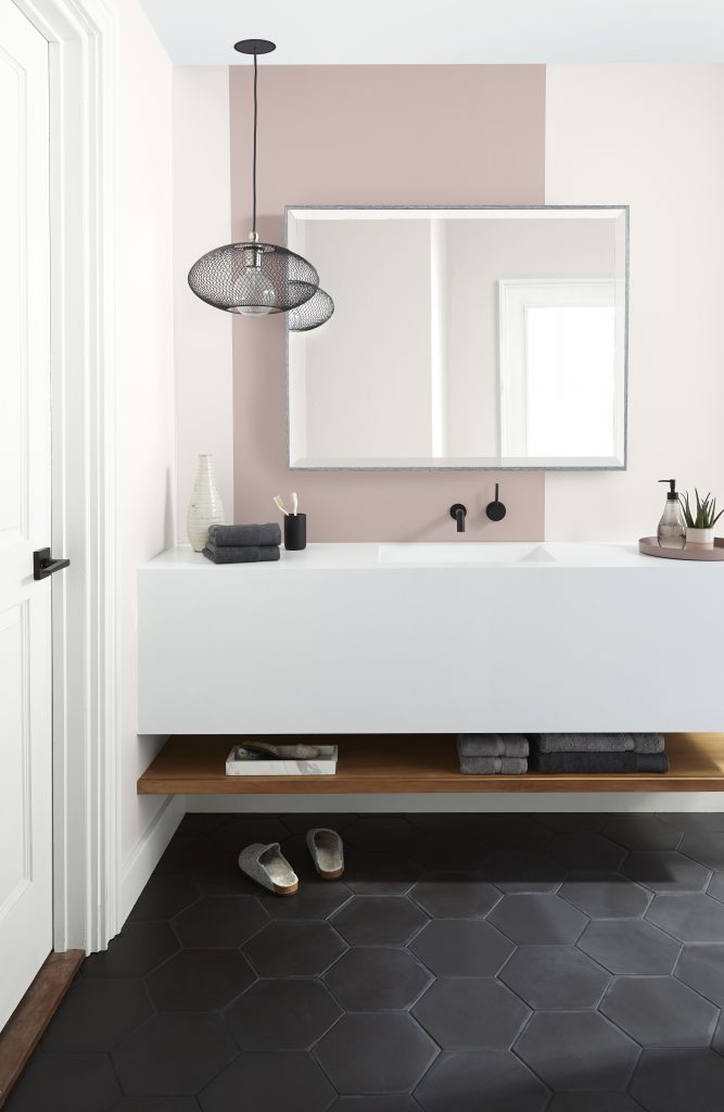 Bathroom with Smokey Pink N150-2 walls, Blank Canvas and Ultra Pure White accents, black hex tile flooring, and modern black fixtures.