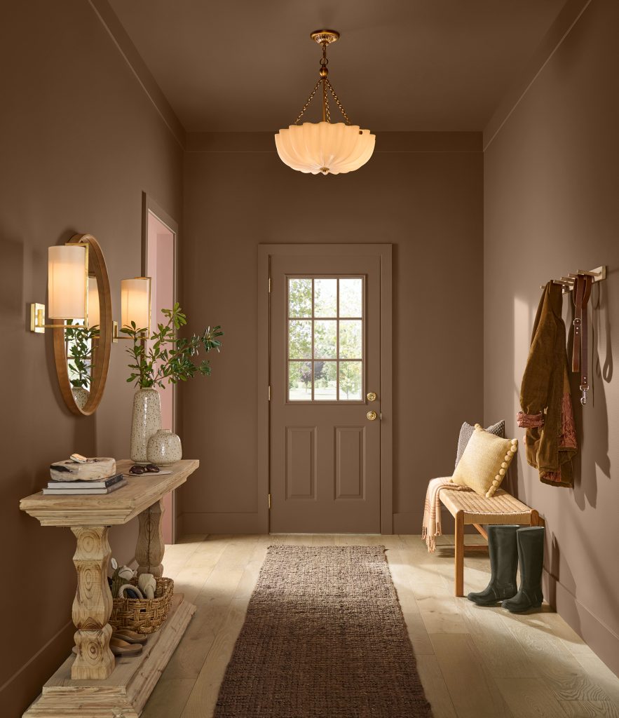 Entryway with walls painted Ancient Root PPU4-20, paired with warm wood, natural textures, soft lighting, and neutral accents.