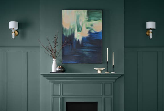 Living room fireplace and walls painted in the Behr 2026 Color of the Year Hidden Gem N430-6A