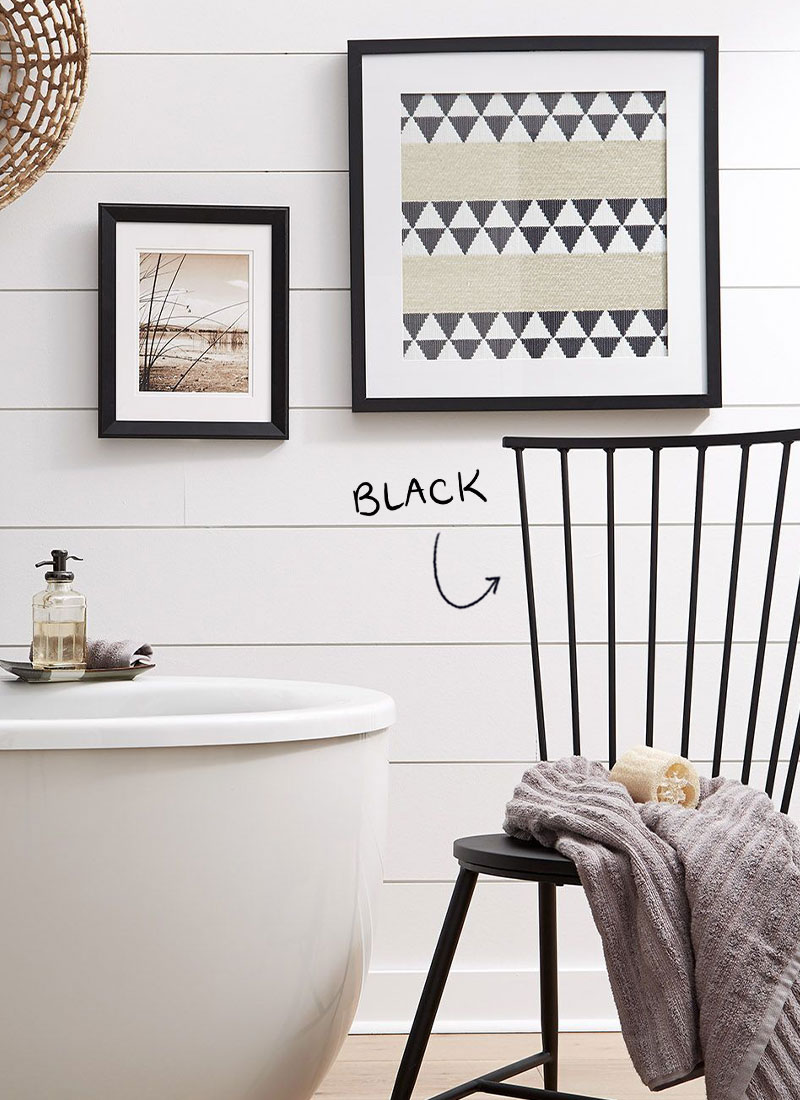 A wooden chair that is spray painted black