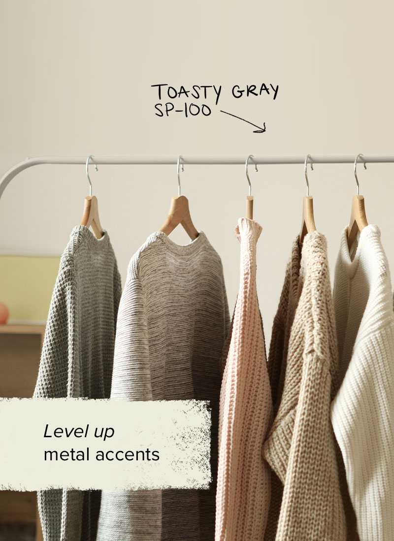 A clothing rack that is spray painted gray