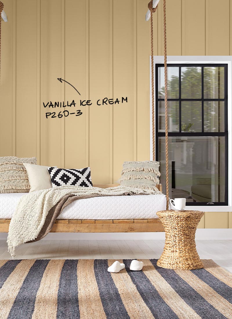 Outdoor sitting area with walls painted in Vanilla Ice Cream, Behr Marquee Exterior paint.