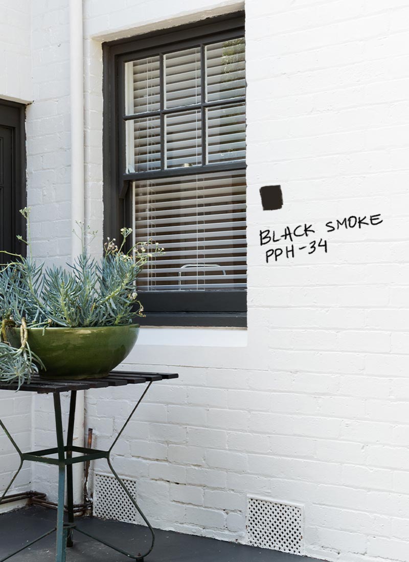 Home exterior with window trim painted in Black Smoke, Behr Premium Cabinet Door & Trim Enamel paint.