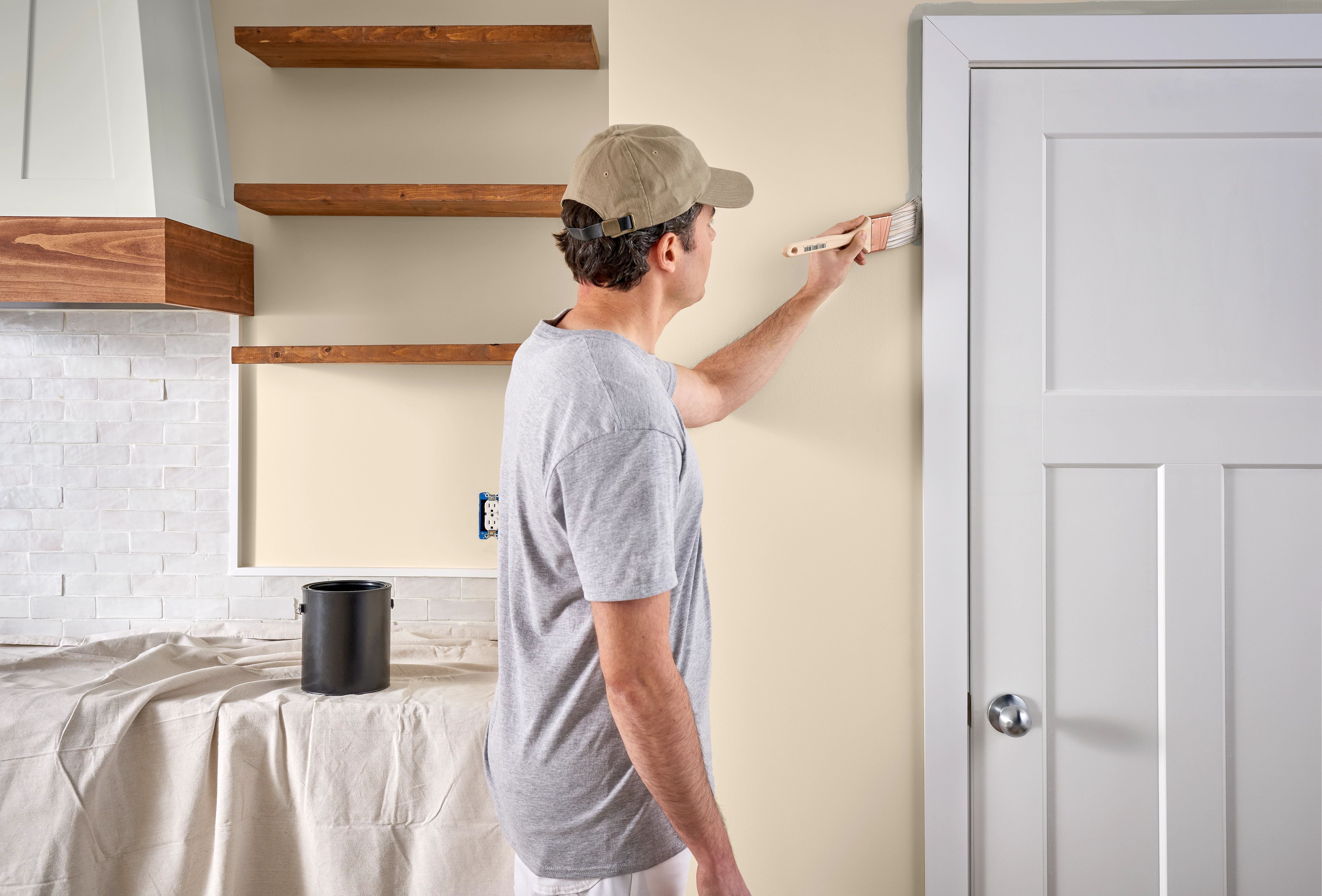 professional painter painting a wall